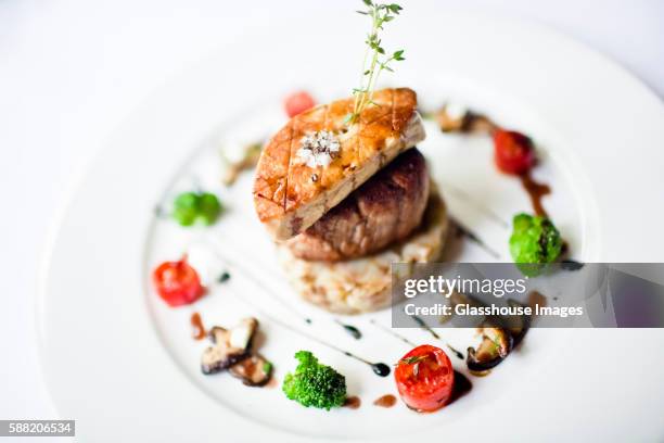 beef tenderloin with seared foie gras and grilled vegetables - french food stock pictures, royalty-free photos & images