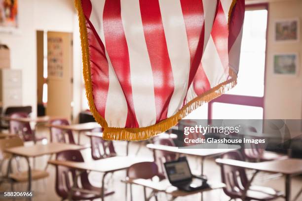 american flag hanging in classroom - hanging flag stock pictures, royalty-free photos & images