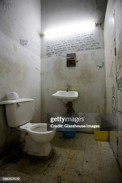 dirty bathroom with writing on walls - bathroom wall stock pictures, royalty-free photos & images