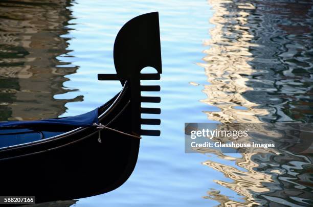 gondola detail reflected against water, venice, italy - ferrol stock pictures, royalty-free photos & images