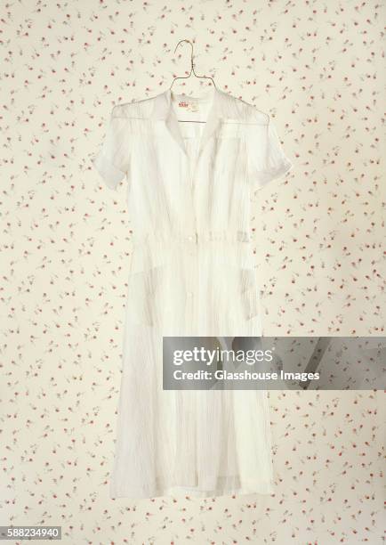 White Dress On Wallpaper High-Res Stock Photo