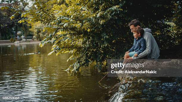 angeln mit meinem vater - extended family outdoors spring stock-fotos und bilder