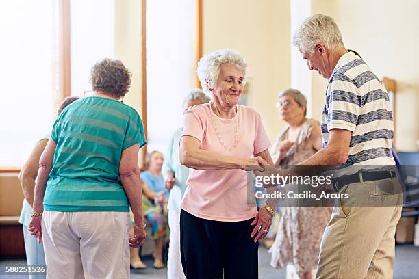 showing off their dance moves - assisted living community stock pictures, royalty-free photos & images