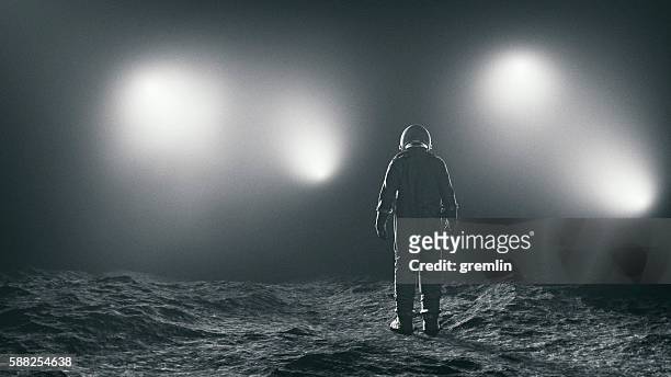 astronaut and the mysterious lights - astronaut moon stock pictures, royalty-free photos & images