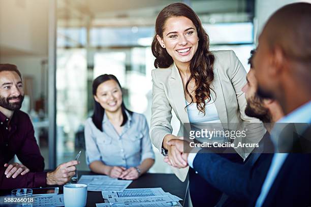 having a positive attitude is rewarding - business meeting stockfoto's en -beelden