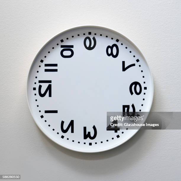 rotated and inverted clock - upside down ストックフォトと画像