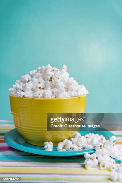 popcorn in yellow bowl - popcorn bildbanksfoton och bilder