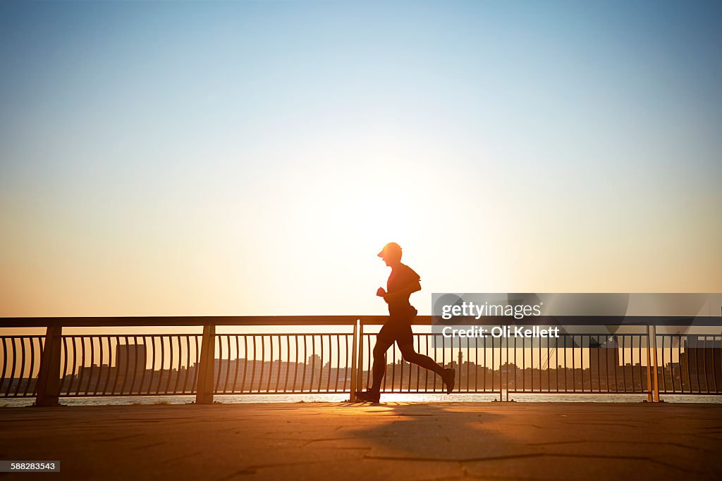 Man enjoying an early morning jog in the city.