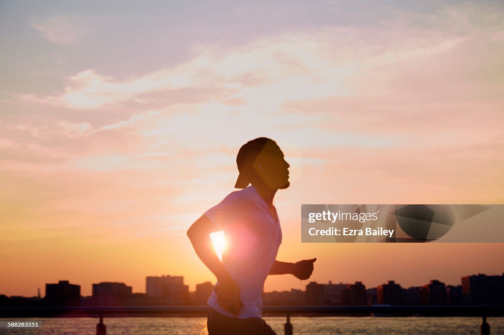 Man enjoying an early morning jog in the city.