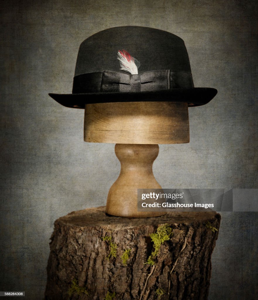 Men's Bowler Hat on Tree Stump