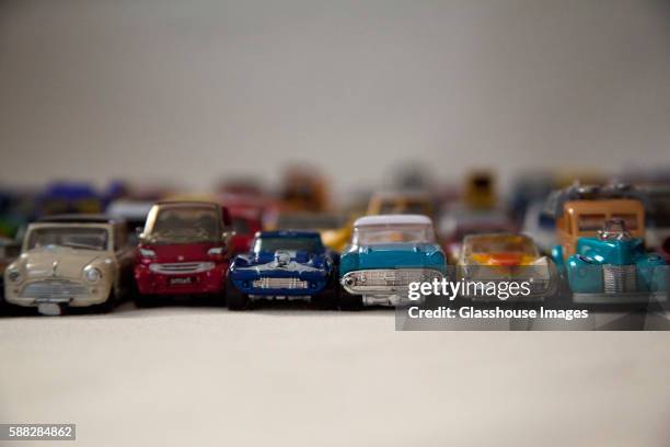 rows of old toy cars - side by side car stock pictures, royalty-free photos & images