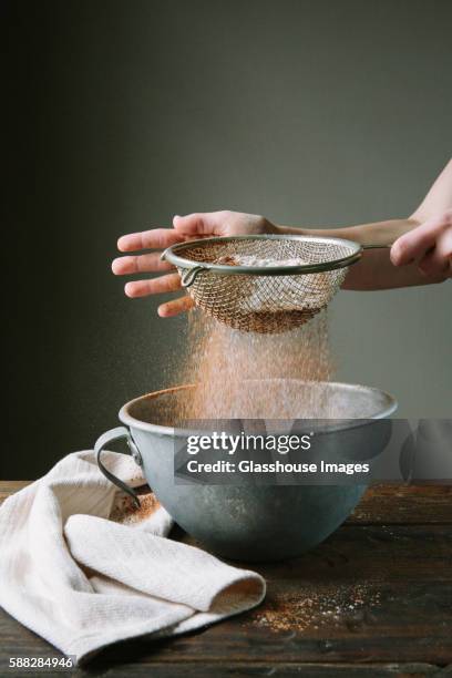 flour and cake mix being sifted into bowl - sieve stock pictures, royalty-free photos & images