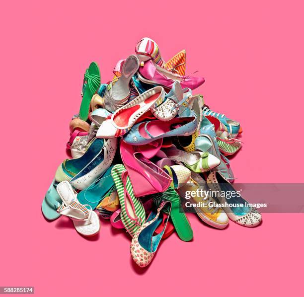 pile of colorful shoes and sneakers - pink shoe bildbanksfoton och bilder