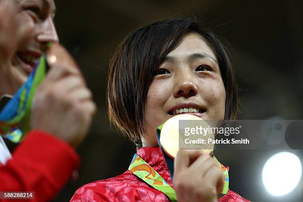 Gold medalist Haruka Tachimoto of Japan stands on the podium during the medal ceremeny for the Women's -70kg Judo on Day 5 of the Rio 2016 Olympic...