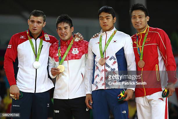 Silver medalist Varlam Liparteliani of Georgia, gold medalist Mashu Baker of Japan, bronze medalist A Donghan Gwak of Korea and bronze medalist B...