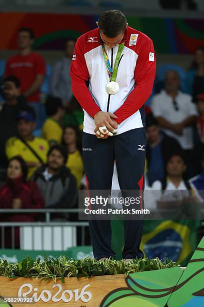 Silver medalist Varlam Liparteliani of Georgia stands on the podium during the medal ceremony for the Men's -90kg Judo on Day 5 of the Rio 2016...