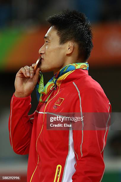 Bronze medalist B Xunzhao Cheng of China stands on the podium during the medal ceremony for the Men's -90kg Judo on Day 5 of the Rio 2016 Olympic...