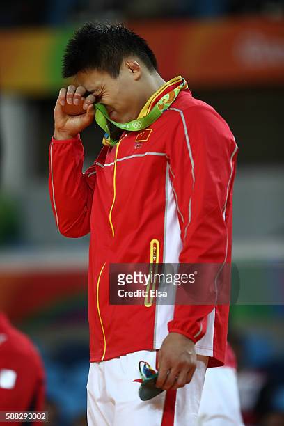 Bronze medalist B Xunzhao Cheng of China stands on the podium during the medal ceremony for the Men's -90kg Judo on Day 5 of the Rio 2016 Olympic...