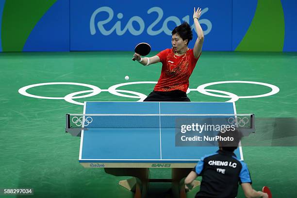 Li Xiaoxia of China returns the ball during the women's singles quarterfinal of table tennis between Li Xiaoxia of Chian and Cheng I-Ching of Chinese...