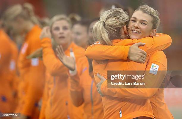 Tess Wester of Netherlands hughs Estavana Polman of Netherlands during the Womens Preliminary Group A match between Norway and Angola at Future Arena...