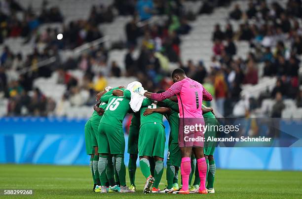 Players of Nigeria concentrate before the match between Colombia and Nigeria mens football for the Olympic Games Rio 2016 at Arena Corinthians on...