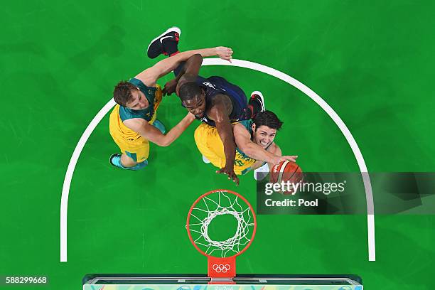 Damian Martin of Australia goes to the basket against Kevin Durant of United States during the Men's Preliminary Round Group A between Australia and...
