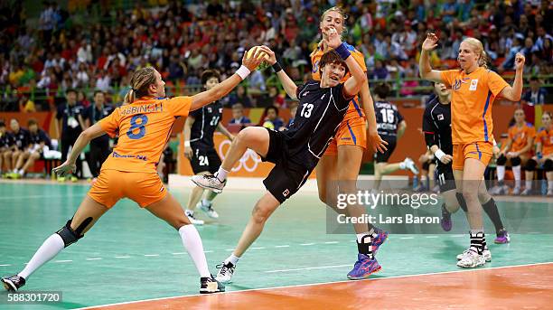 Hyunji Yoo of Korea is challenged by Kelly Dulfer of Netherlands during the Womens Preliminary Group A match between Norway and Angola at Future...