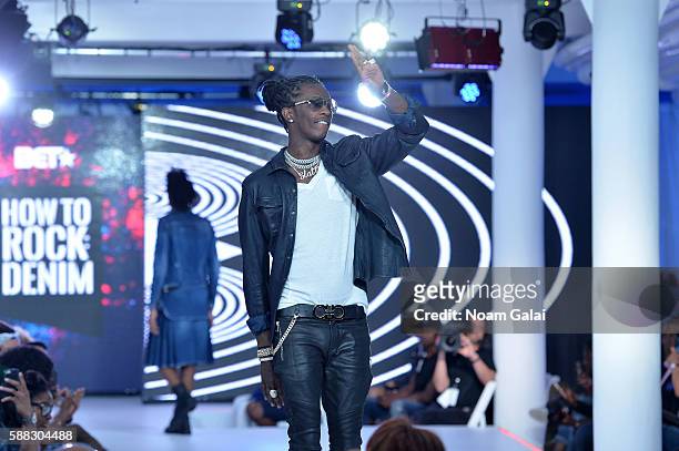 Young Thug greets the audience from the runway during the BET How To Rock: Denim show at Milk Studios on August 10, 2016 in New York City.