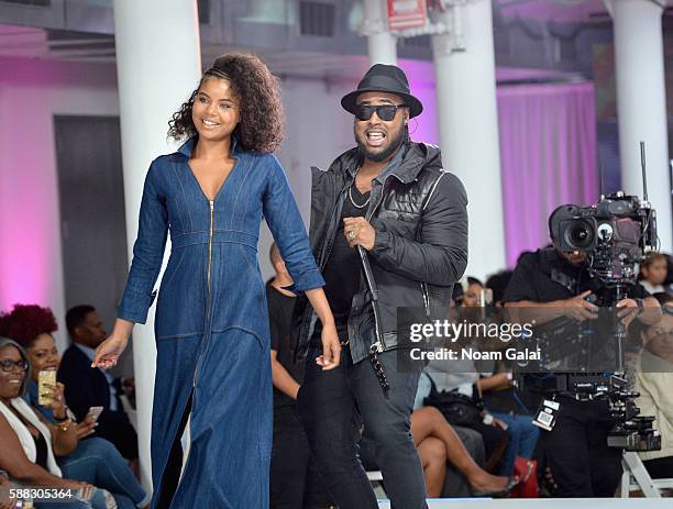 Hip-hop artist Kent Jones performs as models walk the runway during the BET How To Rock: Denim show at Milk Studios on August 10, 2016 in New York...