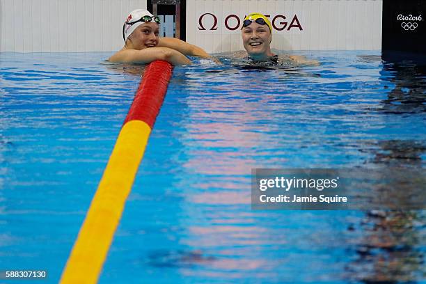 Cate Campbell of Australia celebrates with Penny Oleksiak of Canada in the second Semifinal of the Women's 100m Freestyleon Day 5 of the Rio 2016...