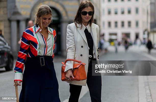 Darja Barannik wearing an orange Loewe bag and white blazer and Janka Polliani wearing a Celine shirt and pink Gucci bag outside Fonnesbech during...