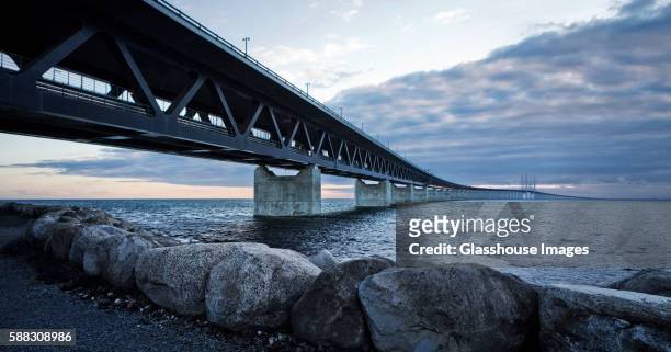 oresund road and rail bridge connecting denmark and sweden - oresund bridge stock pictures, royalty-free photos & images