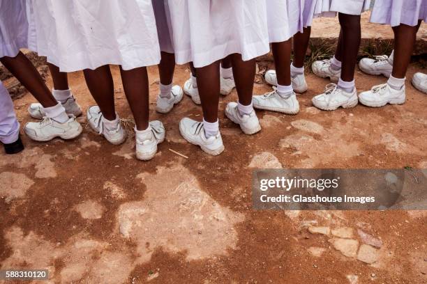 row of young school children's feet with white sneakers, galle, sri lanka - sri lanka people stock pictures, royalty-free photos & images