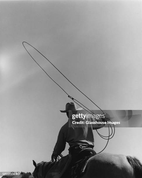 cowboy with lasso - rodeo stock pictures, royalty-free photos & images