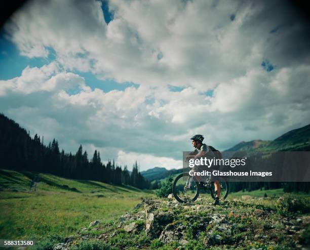 mountain biker resting - glen haven co stock pictures, royalty-free photos & images