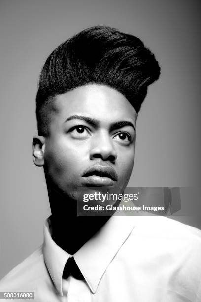 young man with pompadour, portrait - pompadour stock pictures, royalty-free photos & images