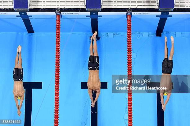Cameron McEvoy of Australia, Nathan Adrian of the United States and Kyle Chalmers of Australia compete in the Men's 100m Freestyle Final on Day 5 of...