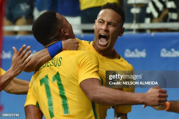 Gabriel Jesus of Brazil celebrates with teammate Neymar his goal against Denmark during the Rio 2016 Olympic Games mens first round Group A football...