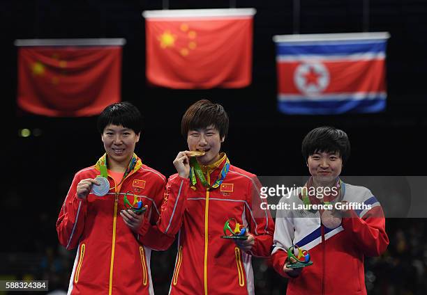 L-r Silver medalist Li Xiaoxia, Gold medalist Ning Ding of China and Bronze medalist I Song Kim of Democratic Peoples Republic of Korea pose during...