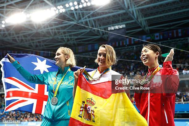 Silver medalist Madeline Groves of Australia, Gold medalist Mireia Belmonte Garcia of Spain and bronze medalist Natsumi Hoshi of Japan pose during...
