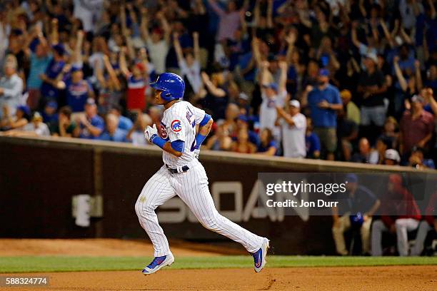 Addison Russell of the Chicago Cubs rounds the bases after hitting a home run against the Los Angeles Angels of Anaheim during the eighth inning at...