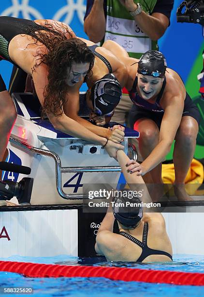 Team United States celebrate winning the Women's 4 x 200m Freestyle Relay Final on Day 5 of the Rio 2016 Olympic Games at the Olympic Aquatics...