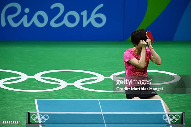 Ning Ding of China celebrates victory over Li Xiaoxia of China during the Womens Table Tennis Singles Final match at Rio Centro on August 10, 2016 in...