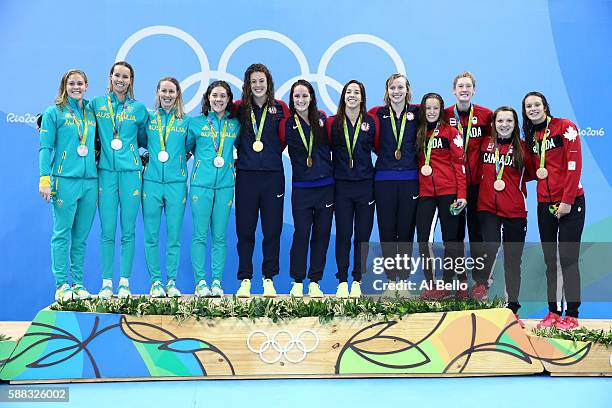 Silver medalists Leah Neale, Emma McKeon, Bronte Barratt and Tamsin Cook of Australia, Gold medalists Allison Schmitt, Leah Smith, Maya Dirado and...