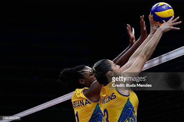 Fabiana Claudino of Brazil and Dani Lins block the ball during the women's qualifying volleyball match between theBrazil and Japan on Day 5 of the...