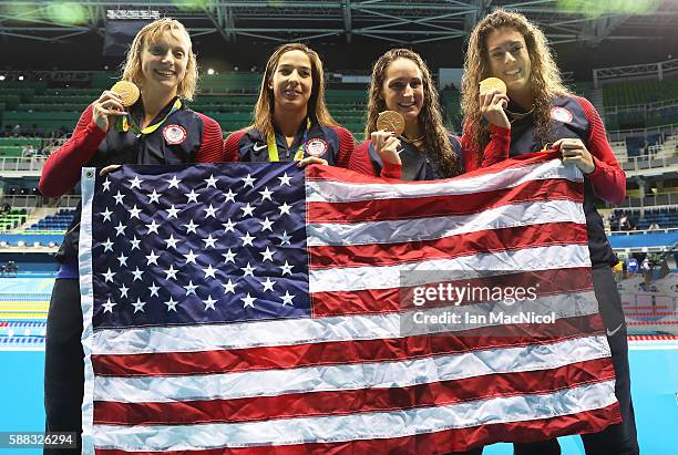 Katie Ledecky, Maya Dirado, Leah Smith and Allison Schimdt of United Statesvpose with their Gold medals from the Women's 4 x 20m Freestyle Relay on...