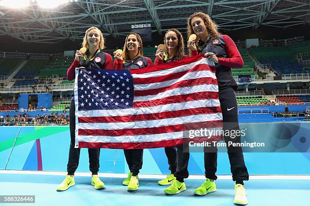 Gold medalists Allison Schmitt, Leah Smith, Maya Dirado and Katie Ledecky of the United States pose during the medal ceremony for the Women's 4 x...