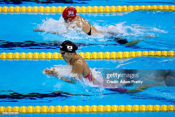 Chloe Tutton of Great Britain and Rie Kaneto of Japan compete in the first Semifinal of the Women's 200m Breaststroke on Day 5 of the Rio 2016...