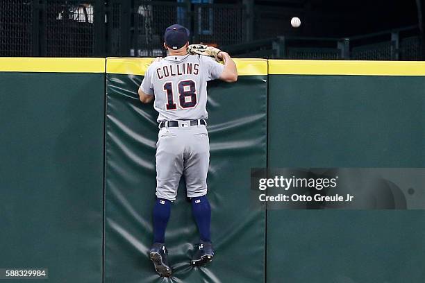 Center fielder Tyler Collins of the Detroit Tigers watches a home run ball off the bat of Nelson Cruz of the Seattle Mariners leave the yard at...