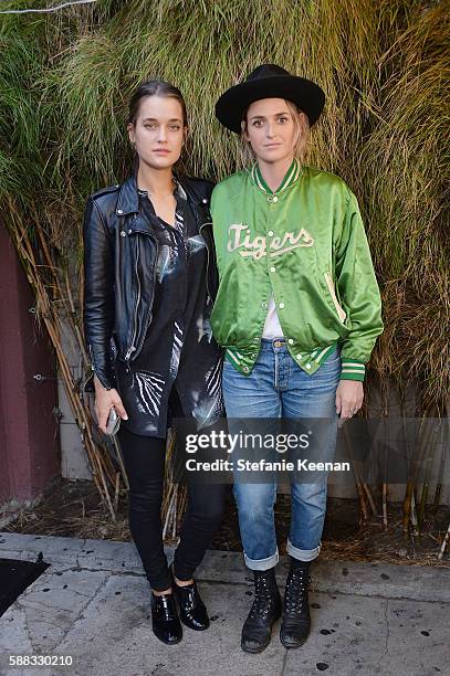 Kate Harrison and Emily Armstrong attend Glamour and AG Denim & Music Dinner in support of MusiCares hosted by Jessica Kantor, Johnathan Crocker,...